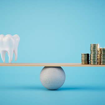 Tooth balancing coins on a ball